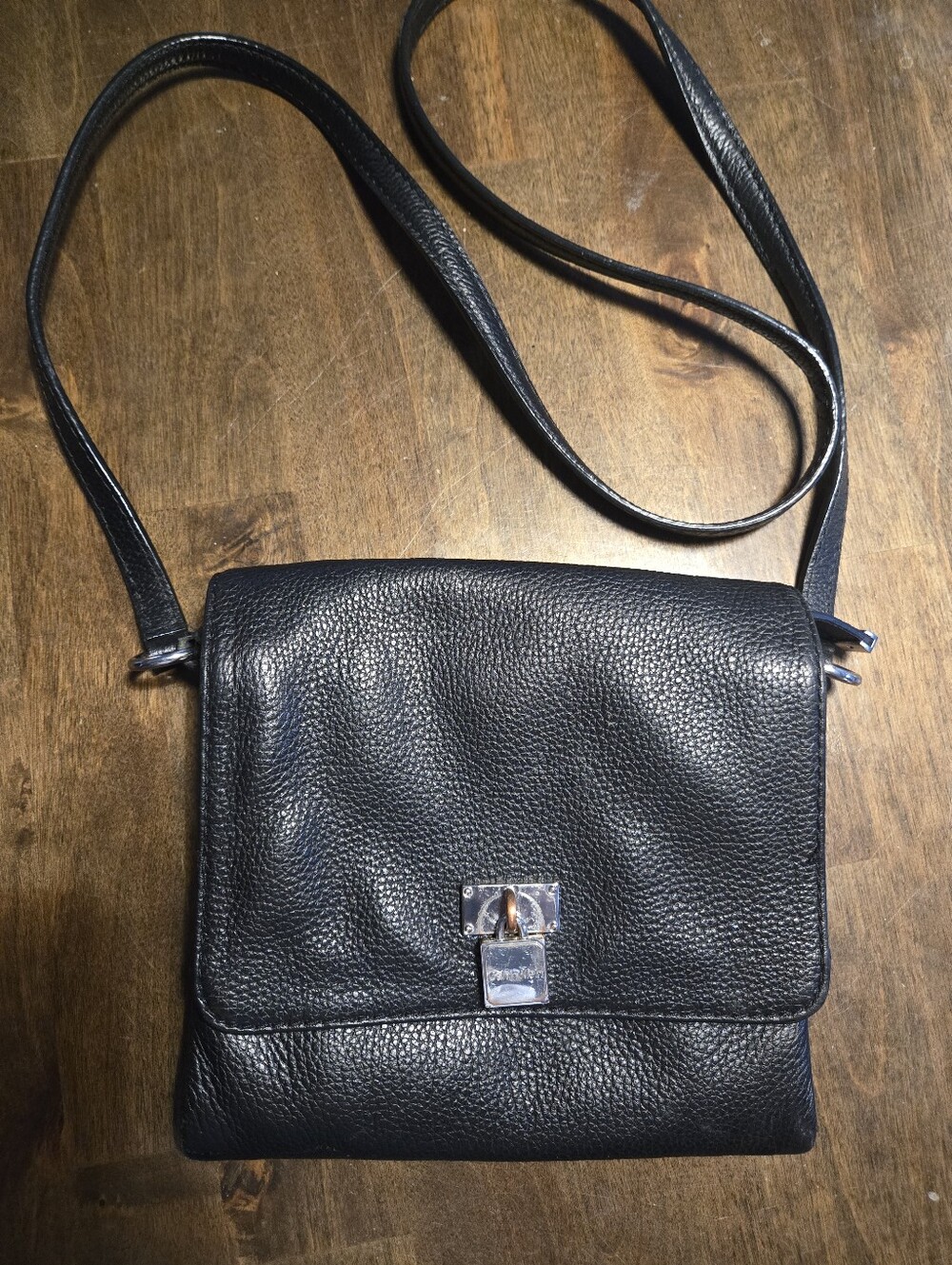 Calvin Klein Black Pebbled Leather Crossbody Flap Bag with Silver Padlock Accent